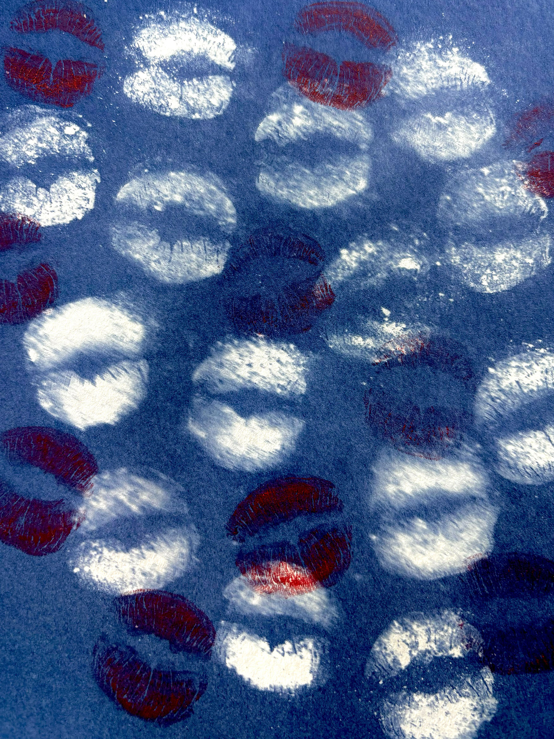 Cyanotype blue image of kiss marks